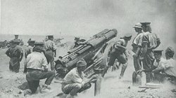 A British battery at work on a sandy ridge in Gallipoli.